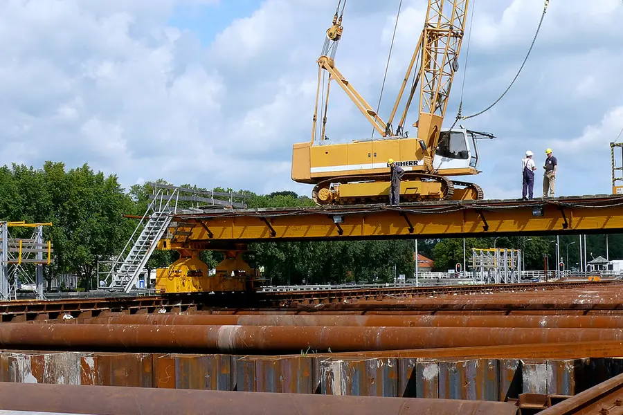 Crawler crane and steel piling on a construction site